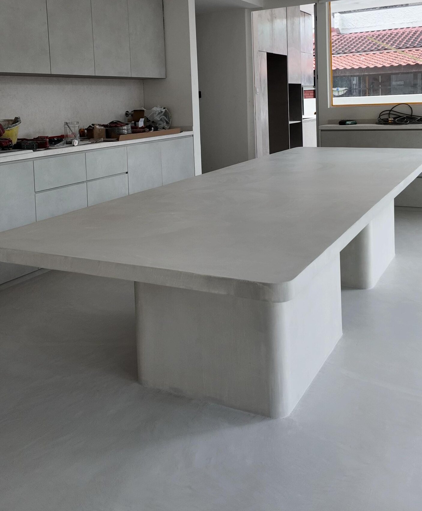 Cast microcement dining table on a microcement floor